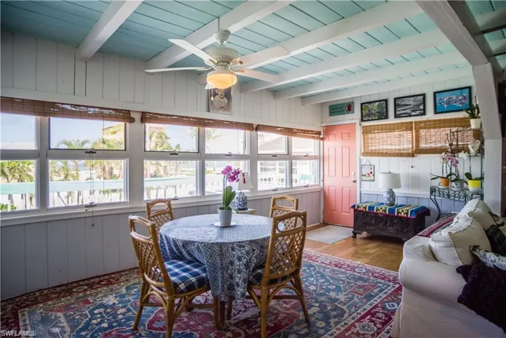 View of Dining area prior to Hurricane Helene beam ceiling and ceiling fan