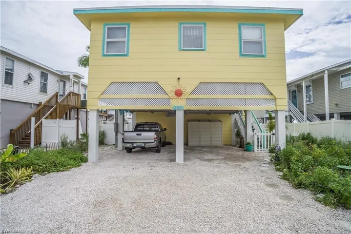 View of front of home prior to Hurricane Helene featuring a carport