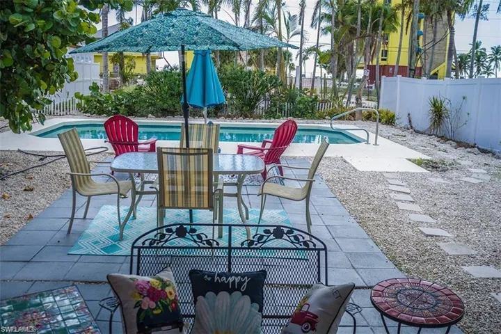 View of patio / terrace prior to Hurricane Helene with a partially fenced in yard