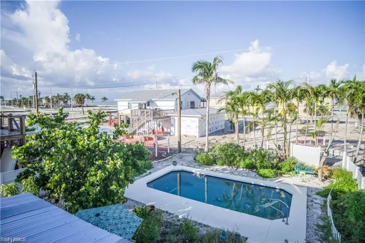 View of swimming pool featuring a patio prior to Hurricane Helene