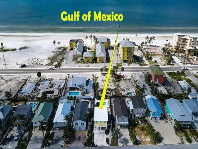 Drone / aerial view prior to Hurricane Helen with a water view and a view of the beach