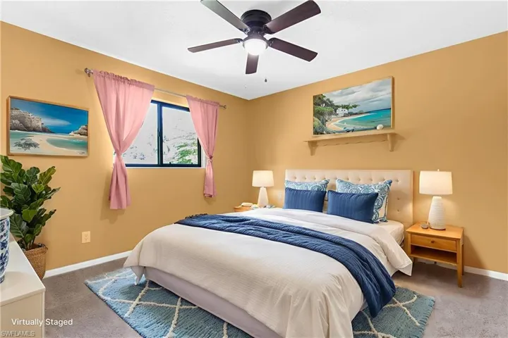 Bedroom with carpet flooring and a ceiling fan