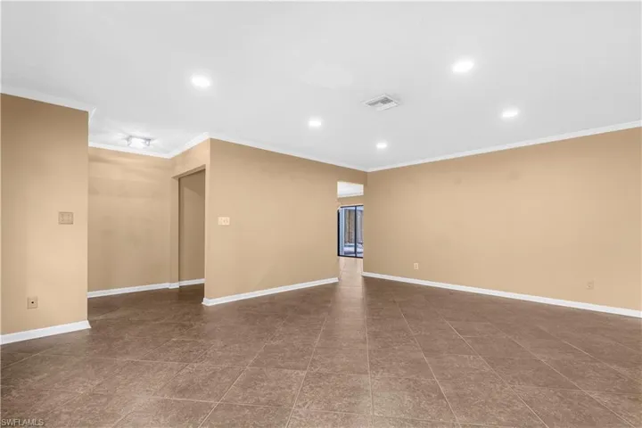 Unfurnished room featuring recessed lighting and crown molding