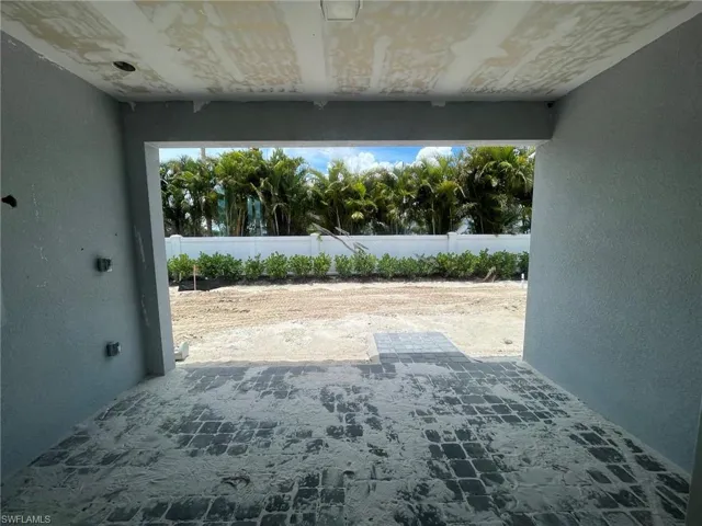 Covered lanai with pre-plumbing for future outdoor kitchen (Pictured on left)