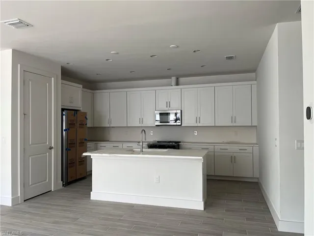 Chef's kitchen with lovely quartz countertops and soft-close cabinets and drawers