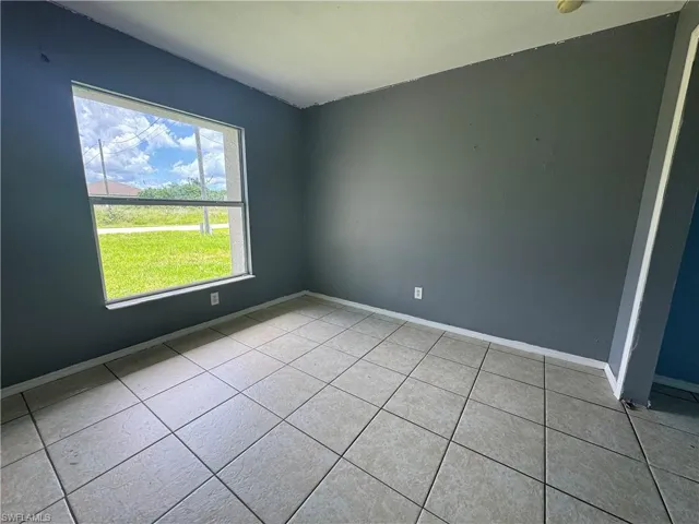 Spare room with light tile patterned floors