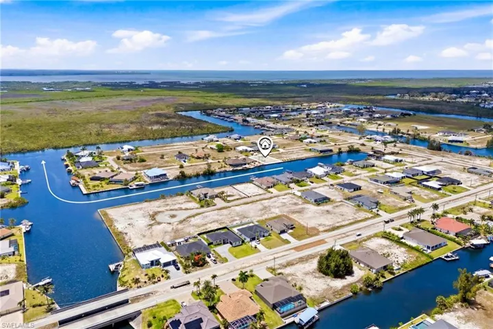 Aerial perspective of a waterfront residential development with extensive canal access