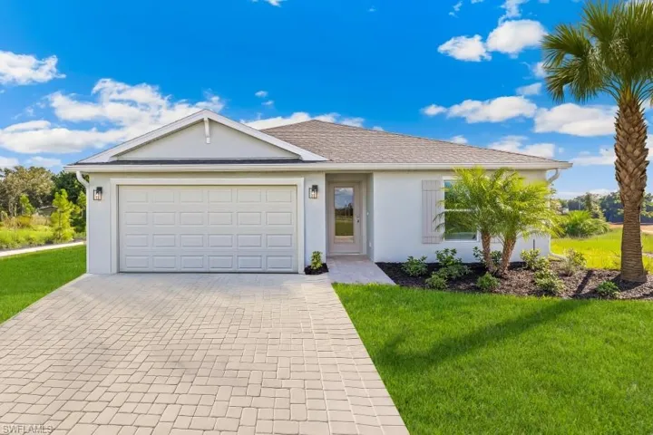 Model Home. Contemporary single-story residence with a light-colored stucco exterior