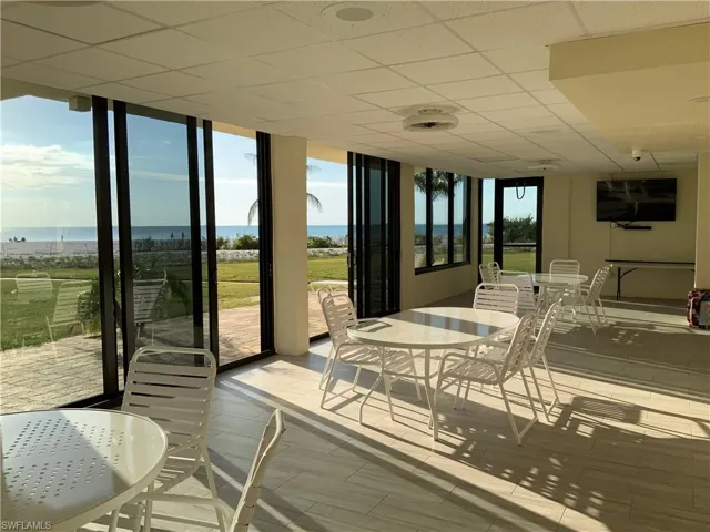 Beach front community room and sun tan deck, has big screen tv