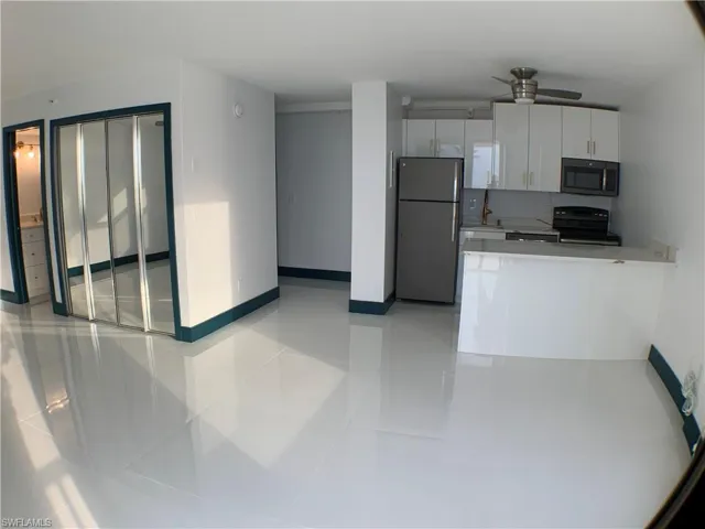 Flooring beautiful, open floor plan ! Living area, kitchen and bedroom on left side with bath.