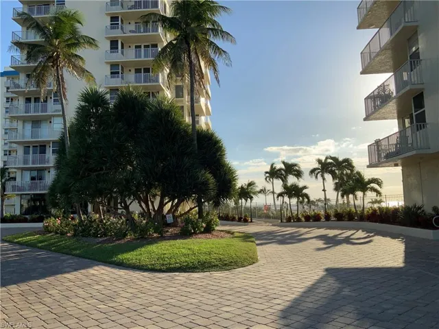 Palm trees and beautiful blooming landscape thru out !