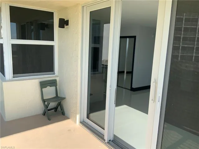 Bedroom and sliders out to balcony , listen to the waves , and watch dolphins ! Storm doors and windows