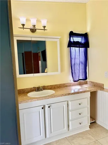 Bathroom featuring vanity and wainscoting