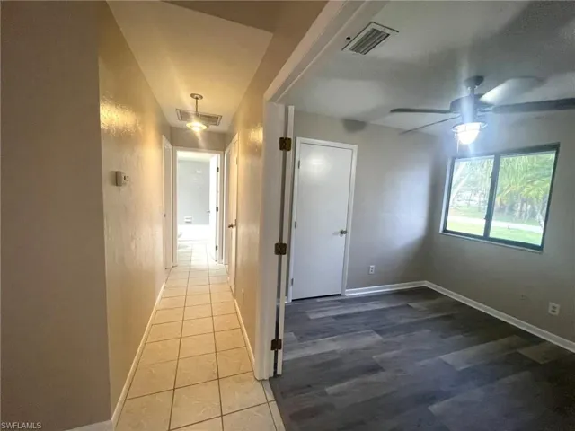 Corridor with tile patterned floors