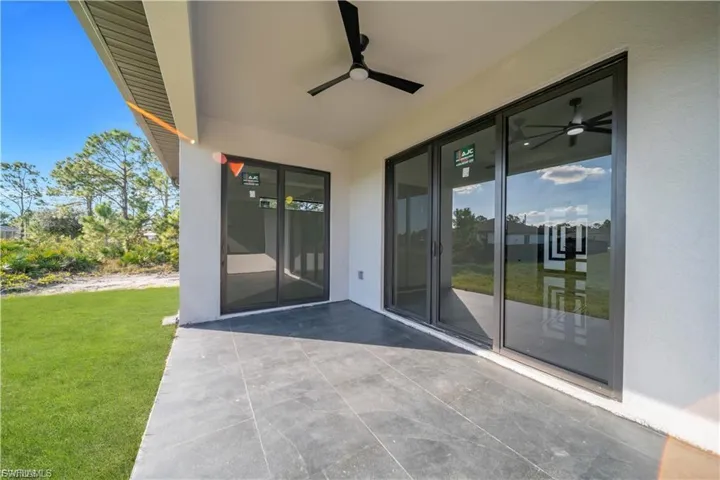 View of patio featuring ceiling fan