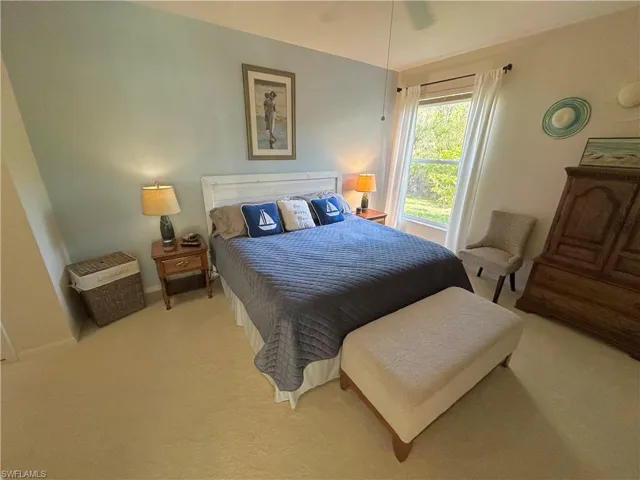 Bedroom with carpet flooring and a ceiling fan