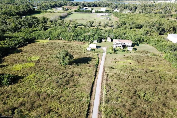 Aerial overview of property's location featuring a forest and rural landscape