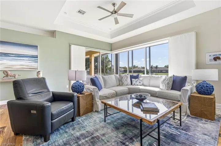 The living area delivers stunning lake views—so captivating, you might “accidentally” forget to leave the couch.