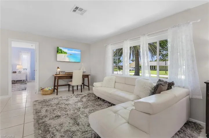 Living room with light tile flooring