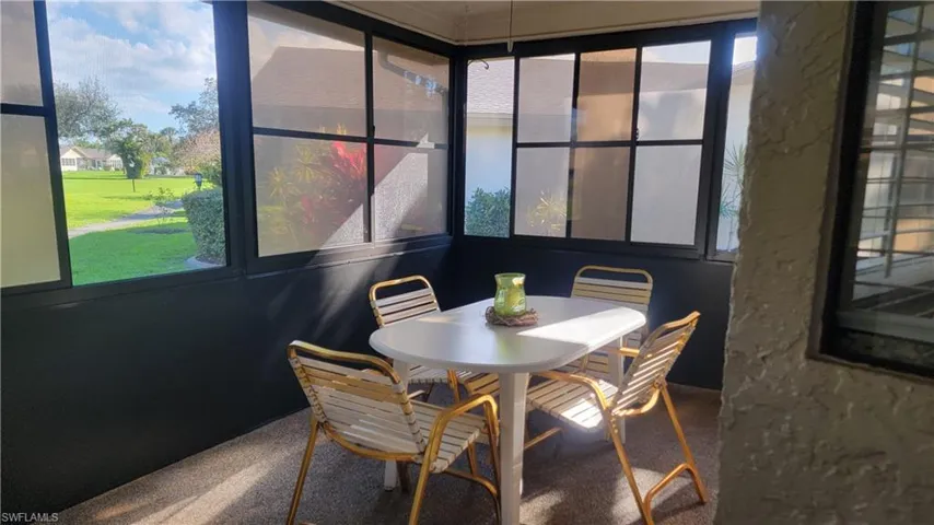 Sunroom featuring a healthy amount of sunlight