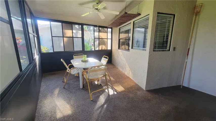 Sunroom featuring ceiling fan