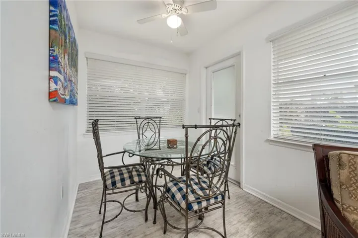 Dining room featuring wood finished floors and a ceiling fan
