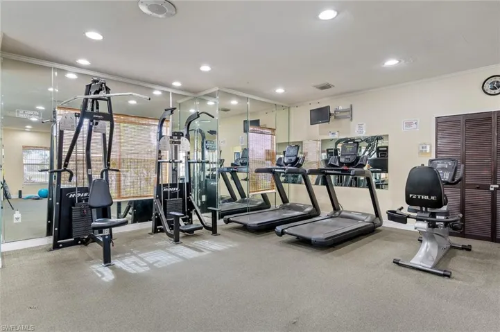 Gym featuring exercise equipment