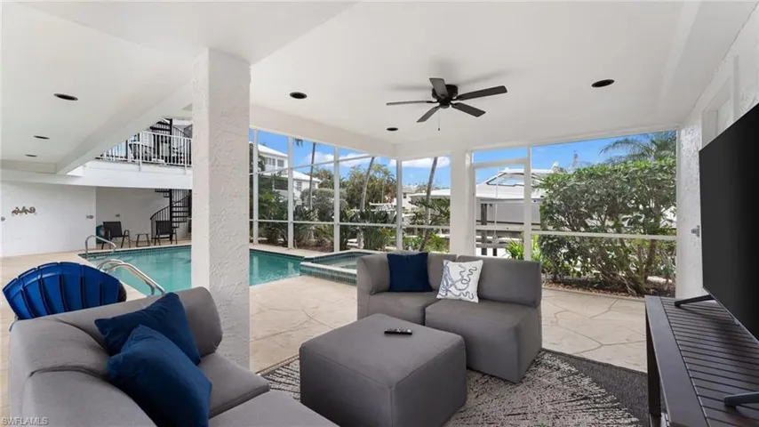 Covered sitting area by pool.