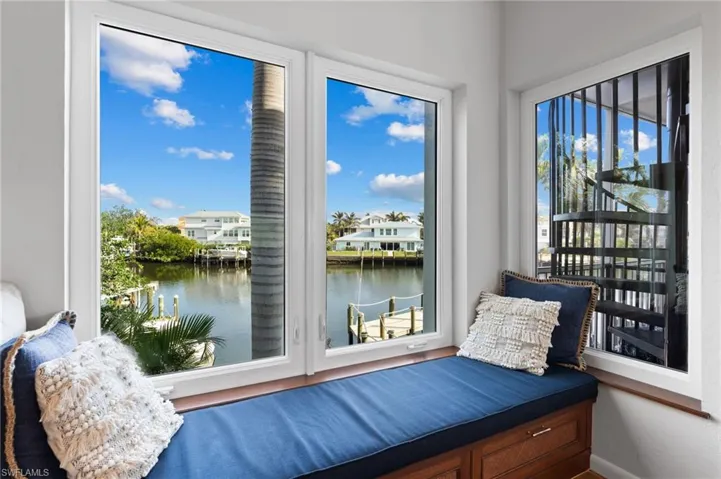Sitting room with a water view and baseboards