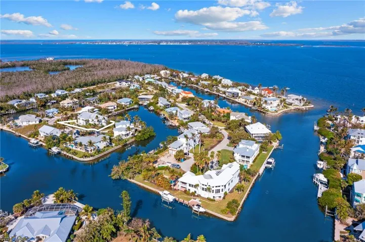 Aerial perspective of suburban area with a nearby body of water