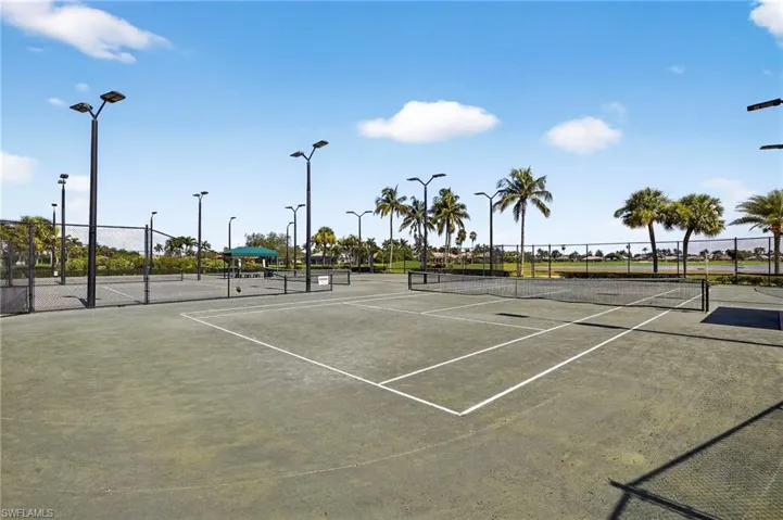 View of tennis court with community basketball court
