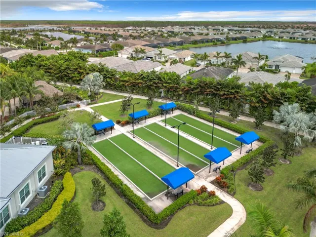 Aerial perspective of suburban area with a nearby body of water