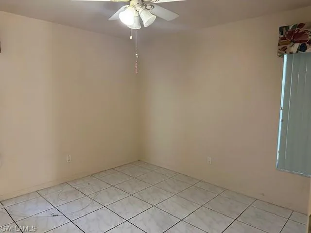 Empty room featuring ceiling fan