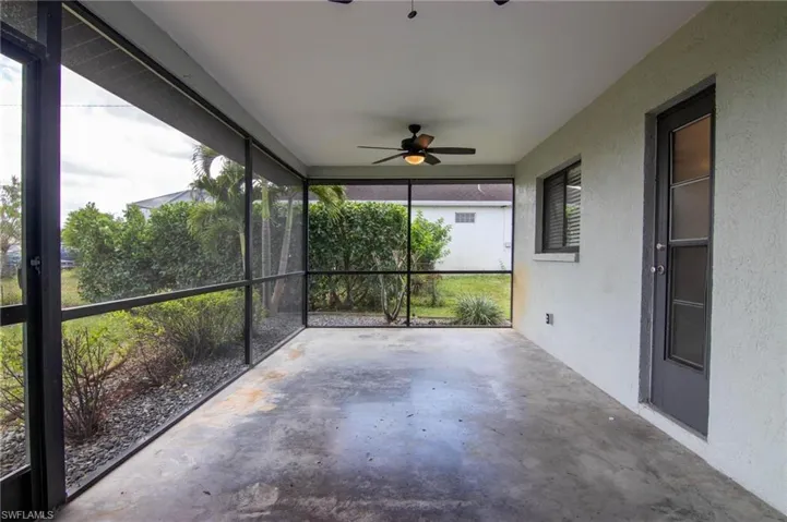Unfurnished sunroom with a ceiling fan