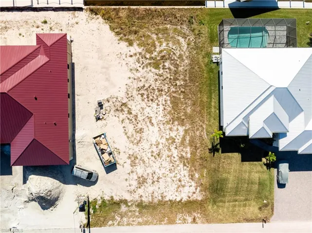 View of subject property featuring a pool area