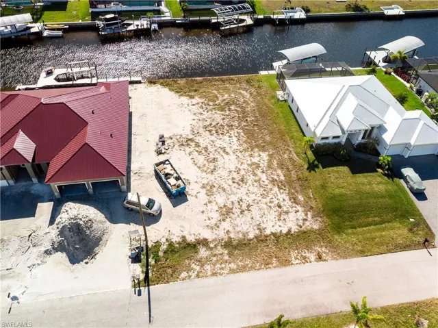 Aerial perspective of suburban area featuring a large body of water