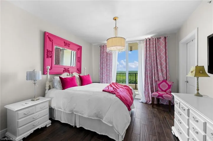 Bedroom with dark hardwood / wood-style floors