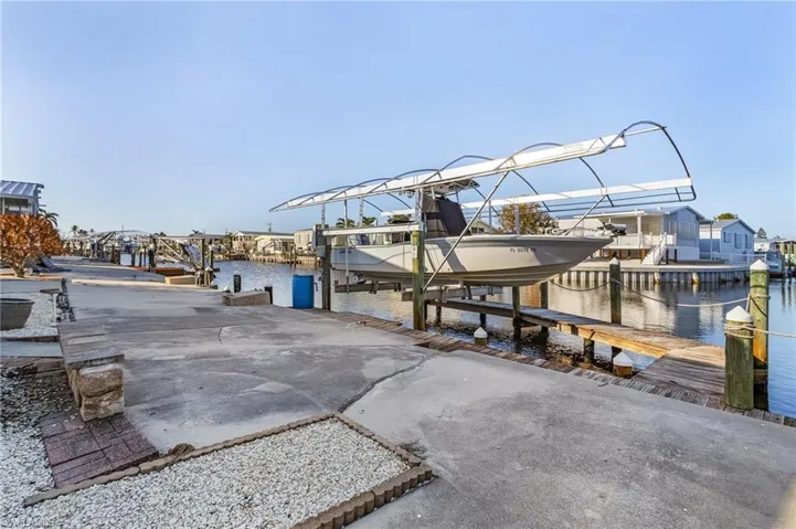 Dock area featuring a water view