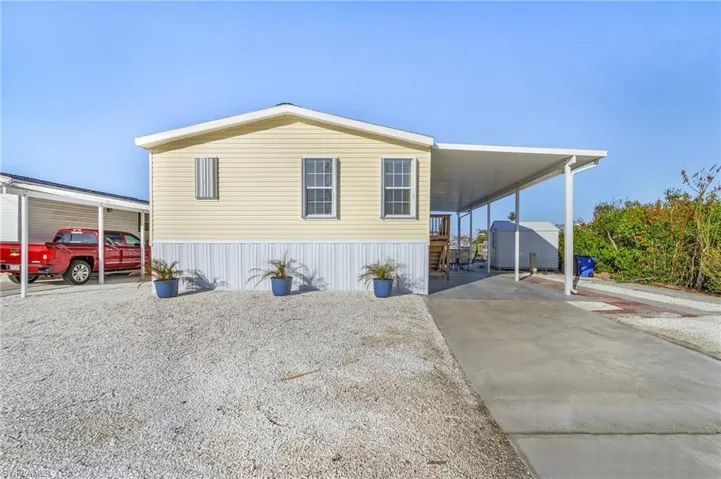 View of front of house with a carport