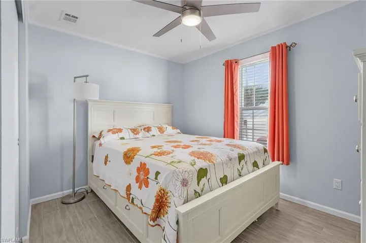 Bedroom featuring light wood-type flooring and ceiling fan