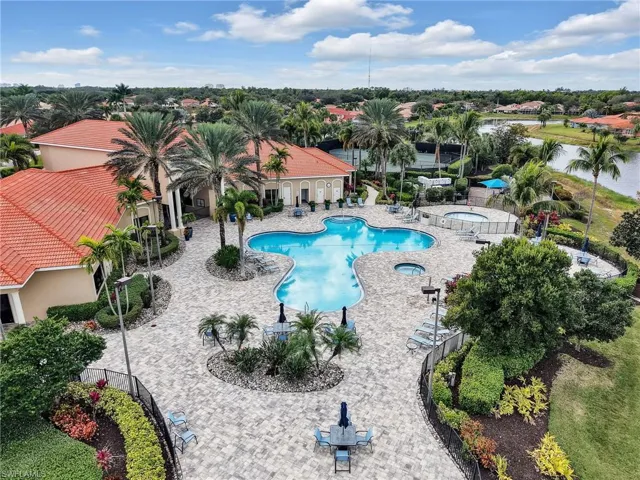Community pool with a community hot tub and a patio
