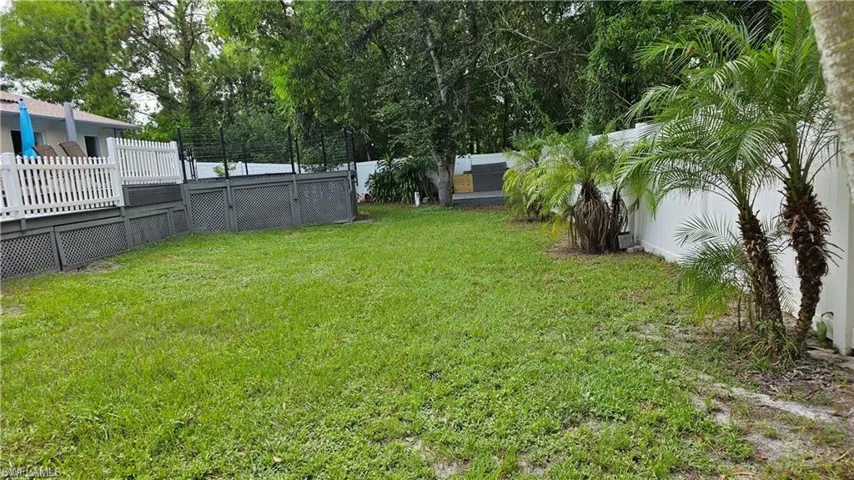 View of fenced backyard