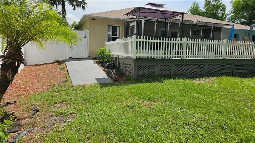 Back of property with stucco siding
