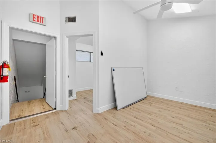 Unfurnished bedroom featuring light wood finished floors and a ceiling fan