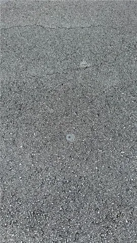 Marker to left of the lot can be found in paved street at the left of where the lot begins.  There is another marker on the street to the right of the lot marking the end of the lot-line almost in front of the lightpole