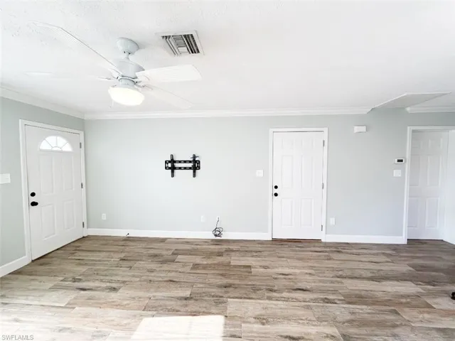 Empty Living Room w TV Wall Mount & Ceiling Fan
