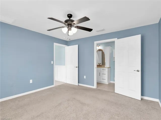 Primary Bedroom With Ceiling Fan and En-Suite Bathroom