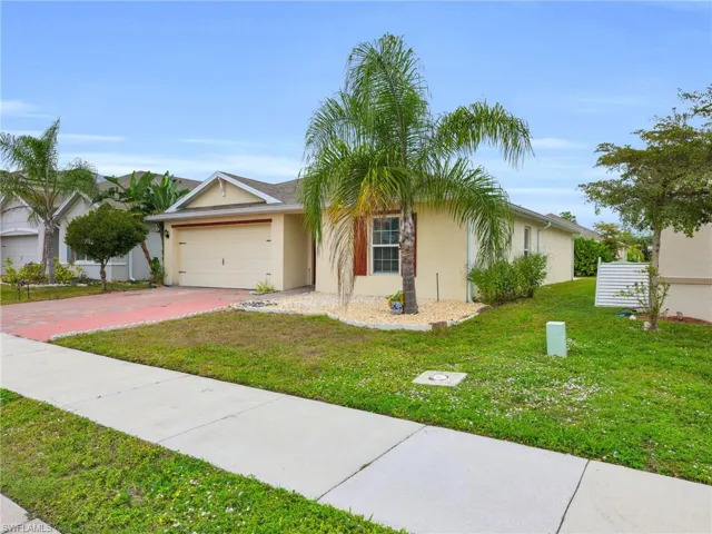 Front Angled View of 731 Hadley Place W With Right Side Yard View And Widened Driveway