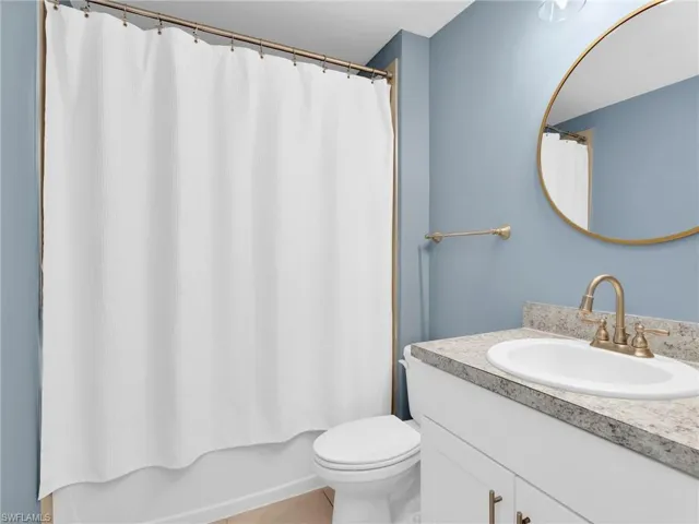 Second Bathroom With Tile Floor and Bather/Shower Combo