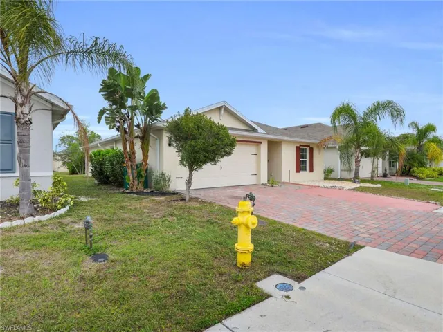 Front Angled View of 731 Hadley Place W With Left Side Yard View And Widened Driveway